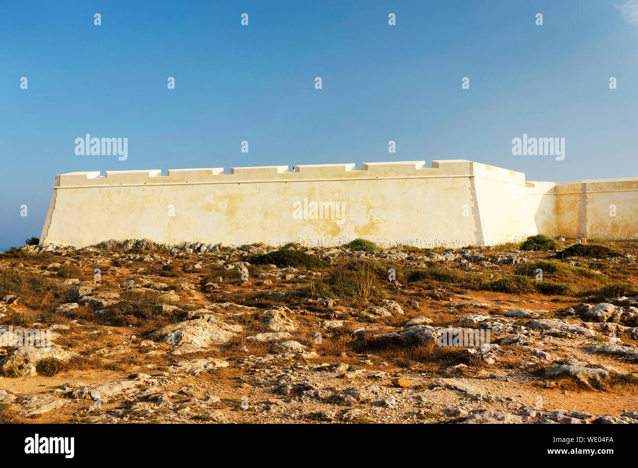 Surrounding Wall Against Clear Blue Sky Stock Photo