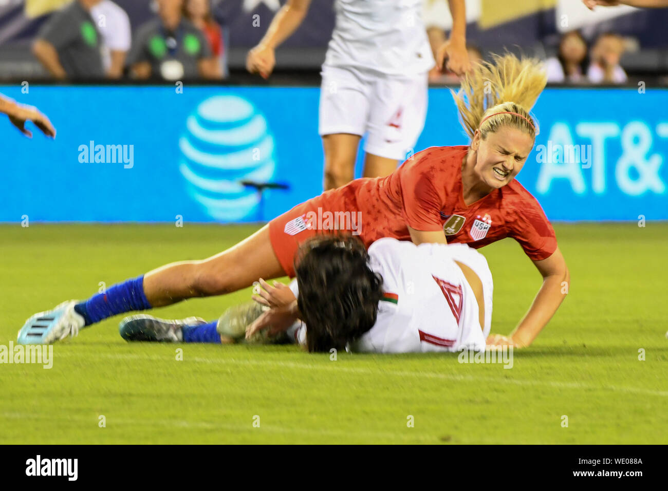 Lindsey Horan United States Soccer - Lindsey Horan of the US women's soccer team is tackled as they defeat Portugal 4-0 during World Cup victory tour. Stock Photo