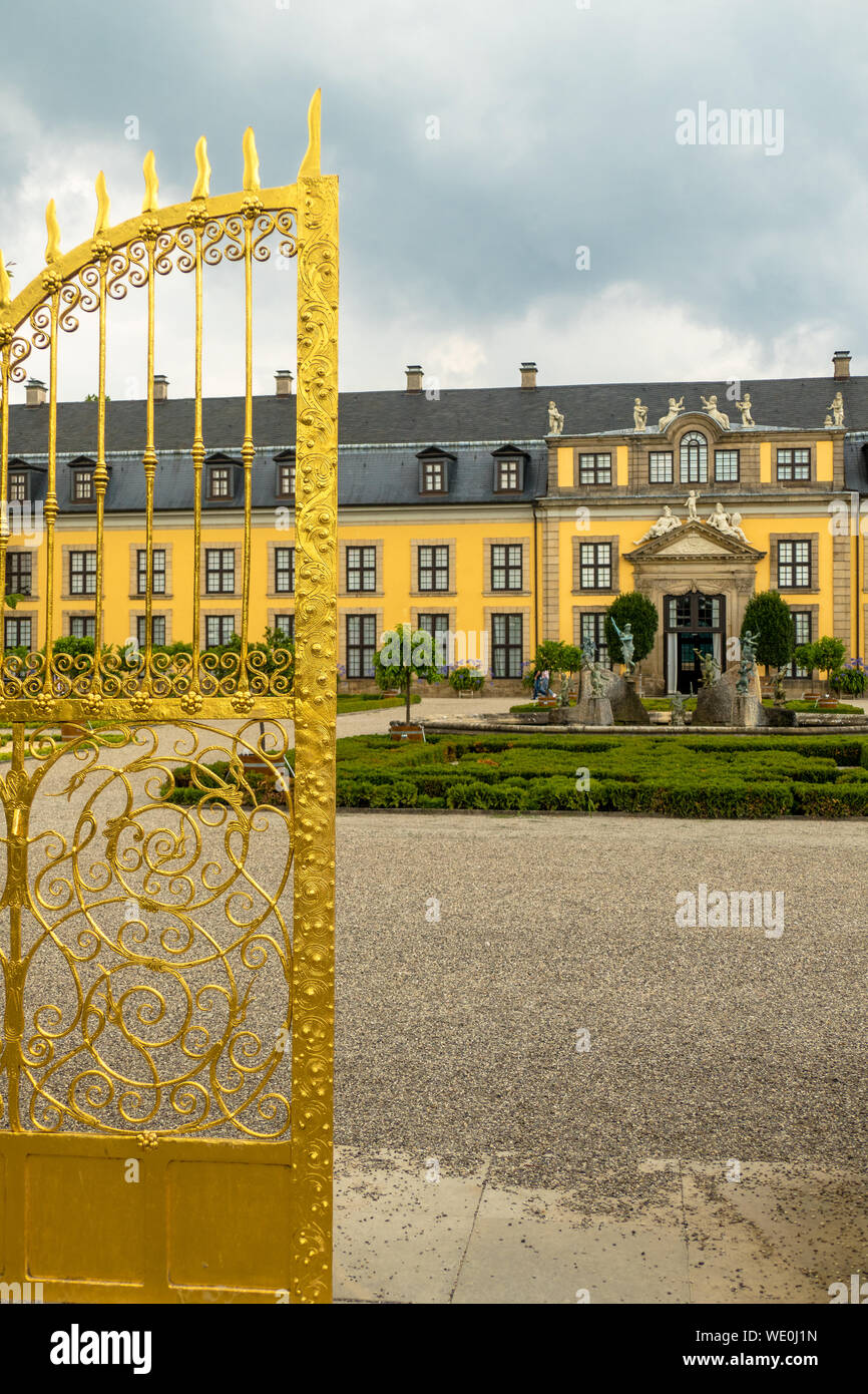 Entrance into the garden of castle in 'Herrenhaeuser Gaerten' in Hannover with golden gate shining Stock Photo