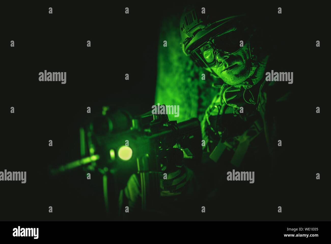 Army Soldier With Sniper Gun At Night Stock Photo