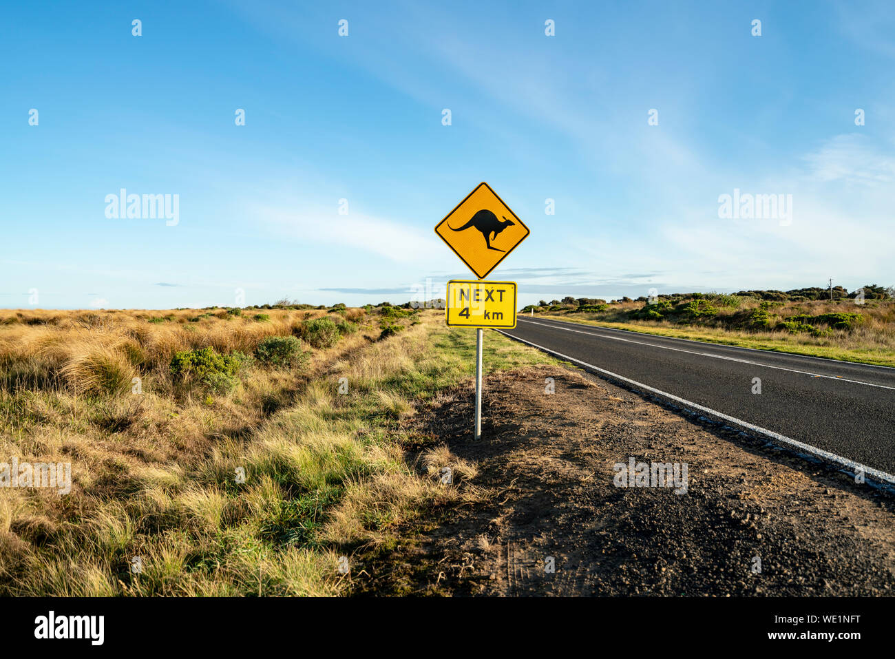 An iconic kangaroo road sign against a blue sky on the Great Ocean Road in Victoria, Australia Stock Photo