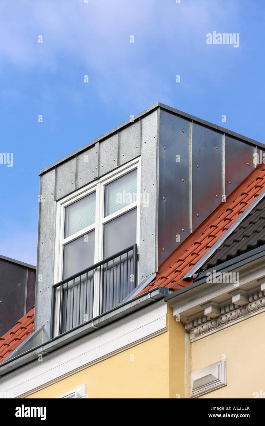 box dormer on rooftop of residential building Stock Photo