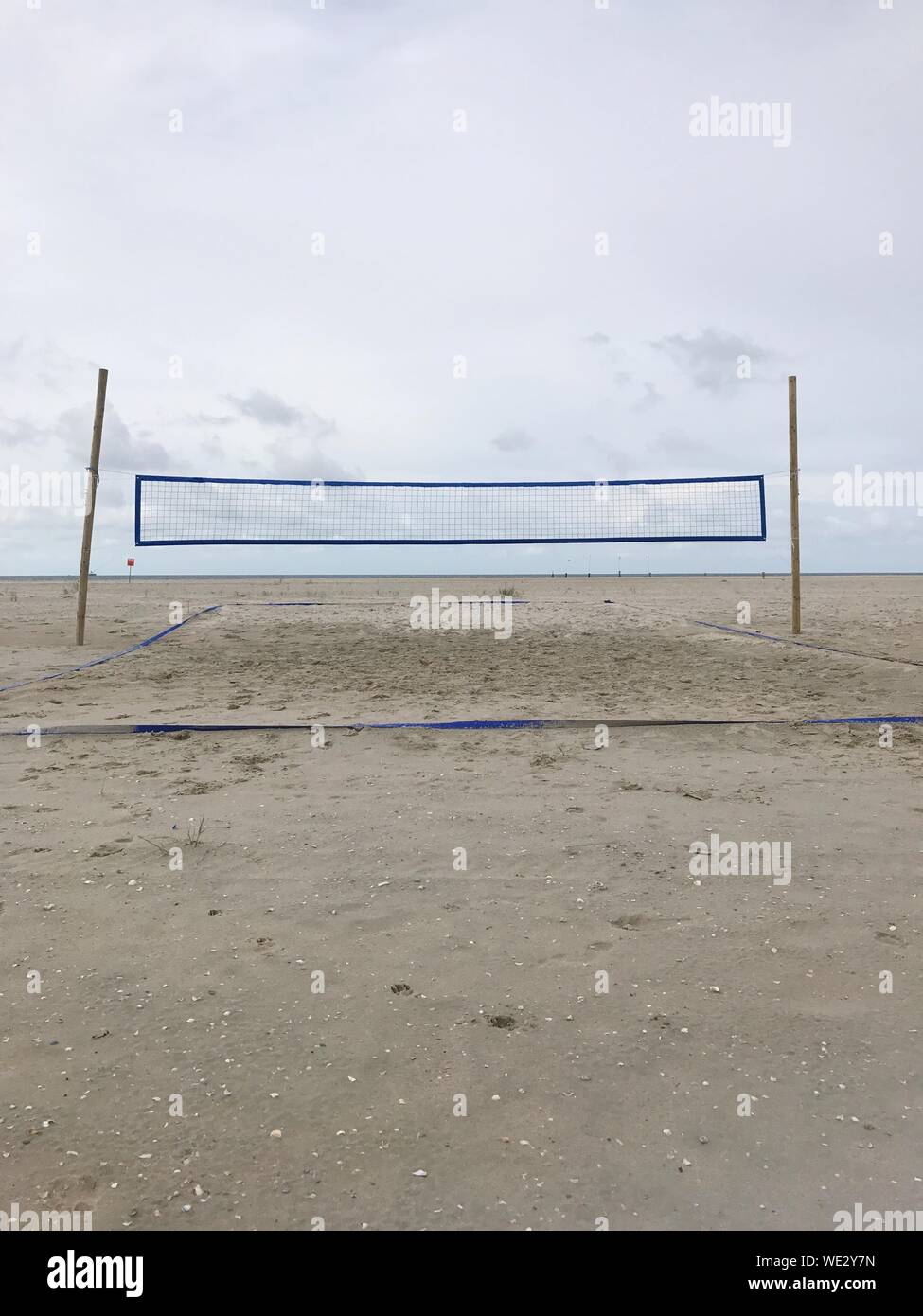 Volleyball Net At Norderney Against Sky Stock Photo