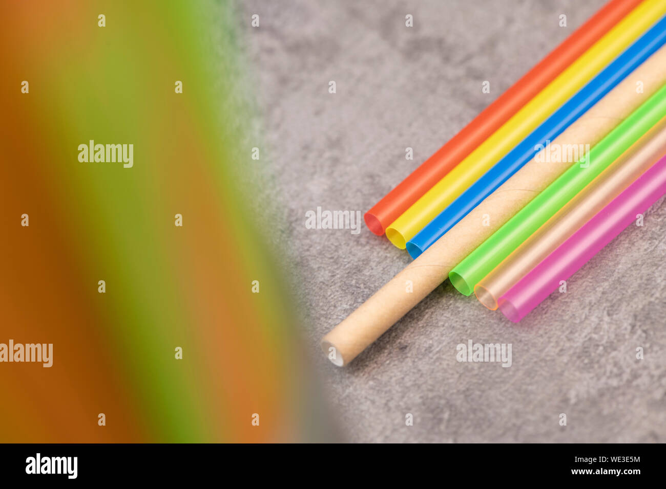 Natural Straw and straws plastic drinking background colourful full