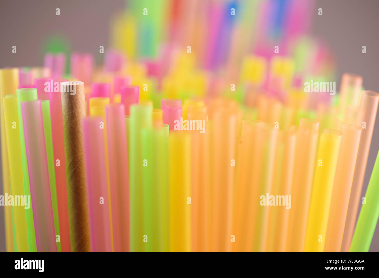 Natural Straw and straws plastic drinking background colourful full