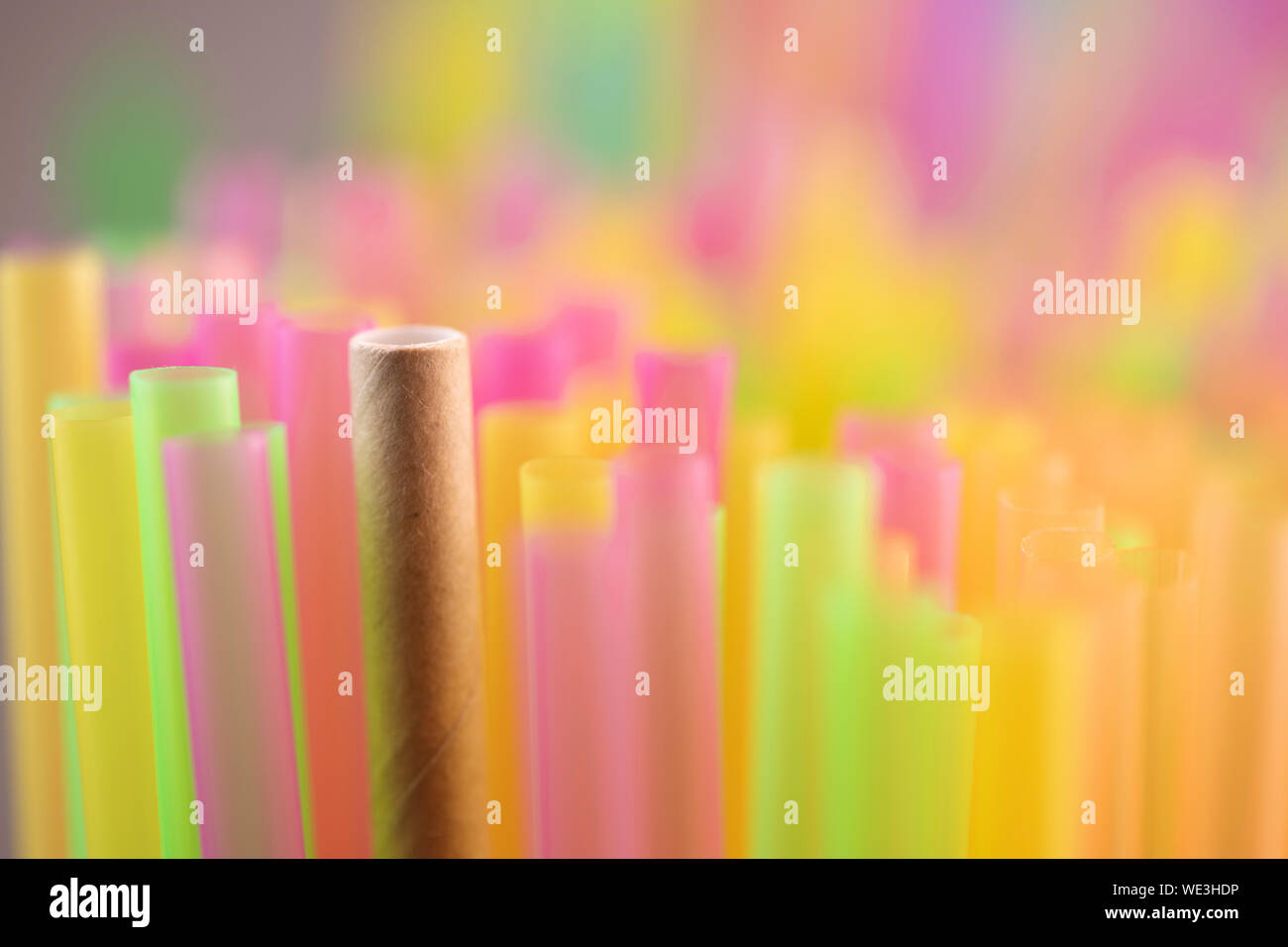 Natural Straw and straws plastic drinking background colourful full