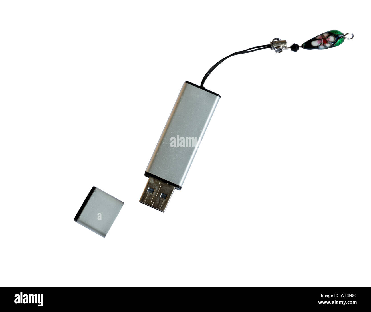 Silver flash drive isolated on white background. Data storage hardware. Stock Photo