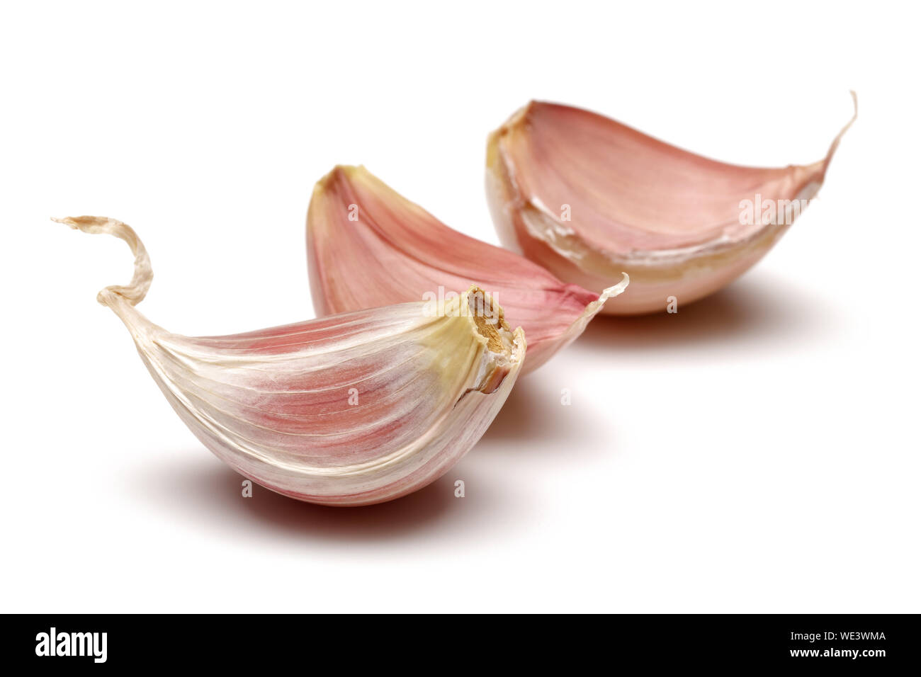Garlic cloves isolated on white background Stock Photo