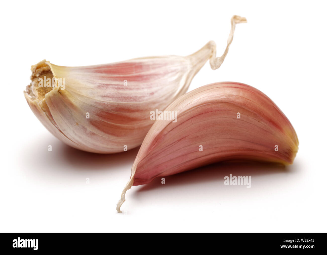 Garlic cloves isolated on white background Stock Photo