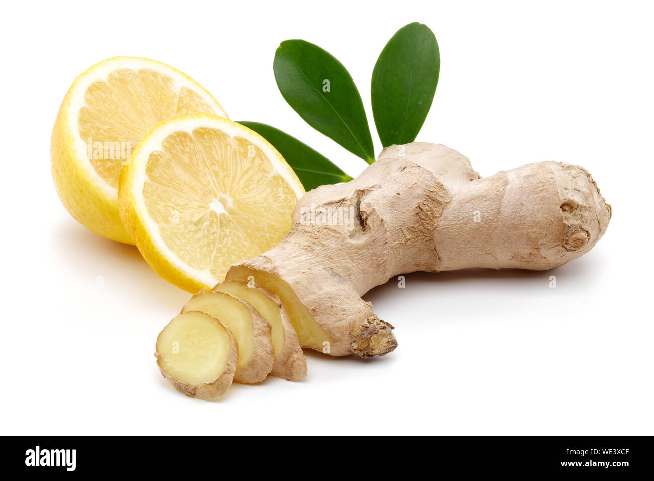 Fresh ginger and lemon with leaves isolated on white background Stock Photo