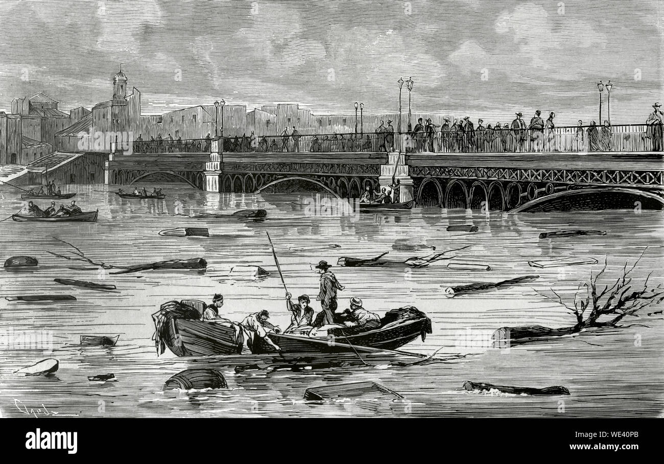 Spain, Andalusia, Seville. Floods in the city. Overflow of the Guadalquivir river. View of the Triana Bridge on the afternoon of December 8, 1876. Engraving by Capuz. La Ilustracion Española y Americana, December 22, 1876. Stock Photo