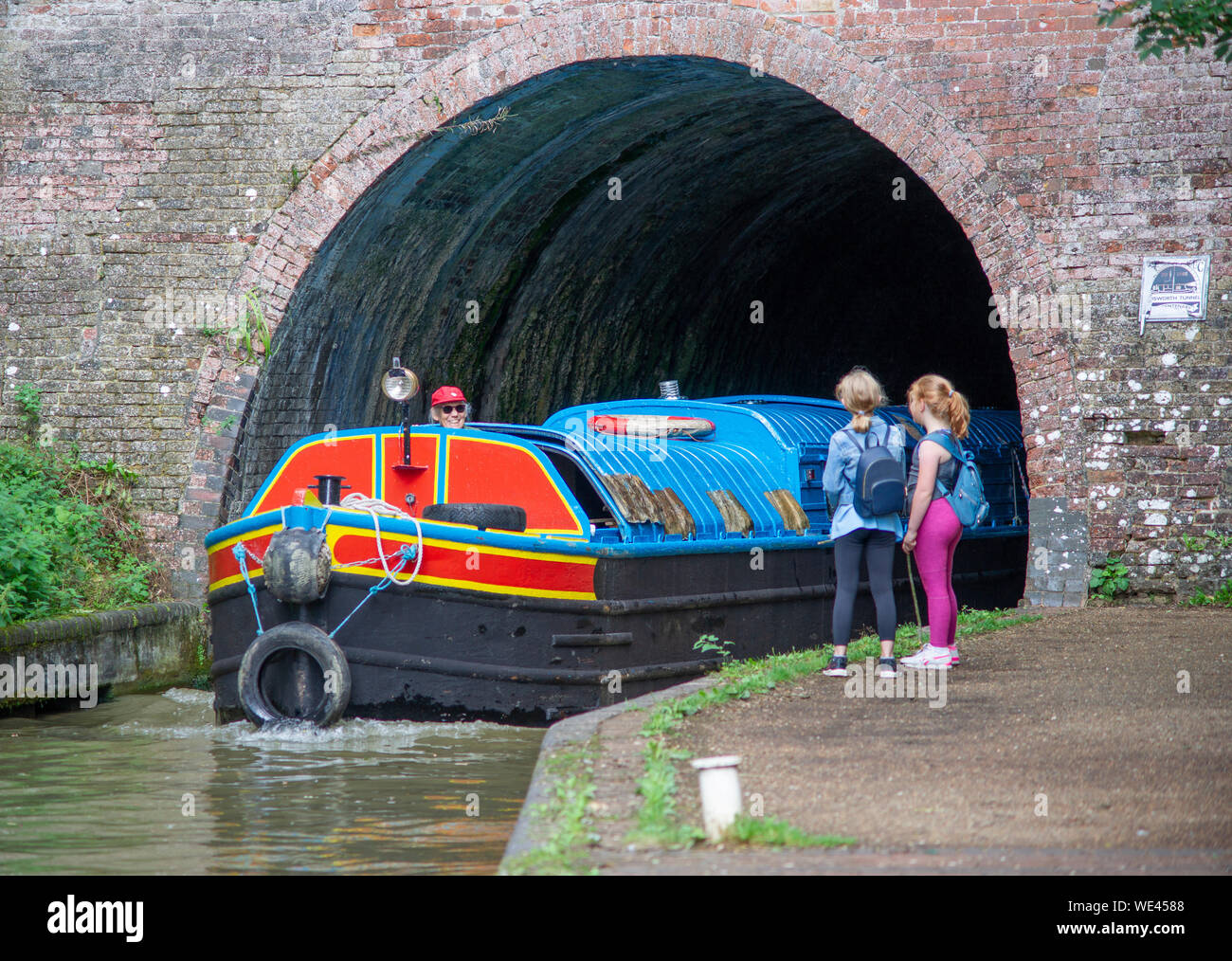 Narrow Boat, Kew, originally a butty then engine fitted. Coming out if the Blisworth Tunnel on Grand Union Canal, UK Stock Photo