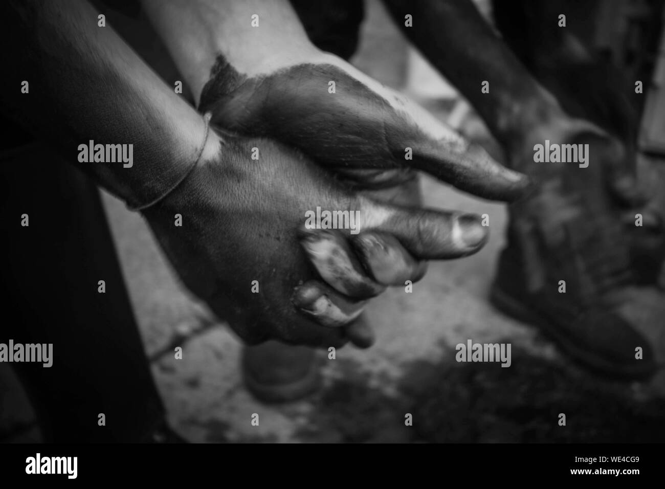 Rubbing hands Black and White Stock Photos & Images Alamy