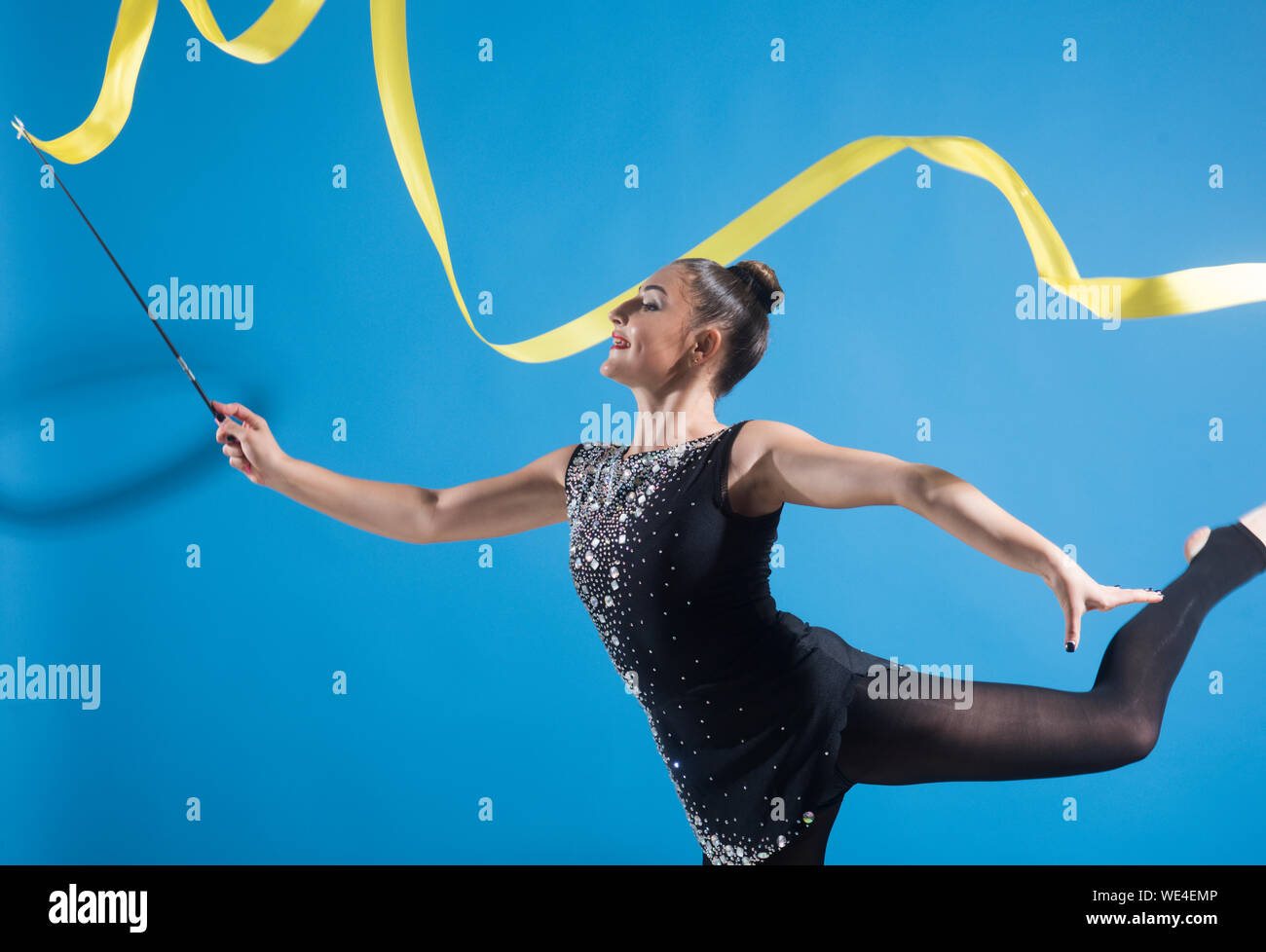 Woman with ribbon for rhythmic gymnastic. Workout sports activities in gym  of flexible girl. Sport success and health. Woman train acrobatics with rib  Stock Photo - Alamy