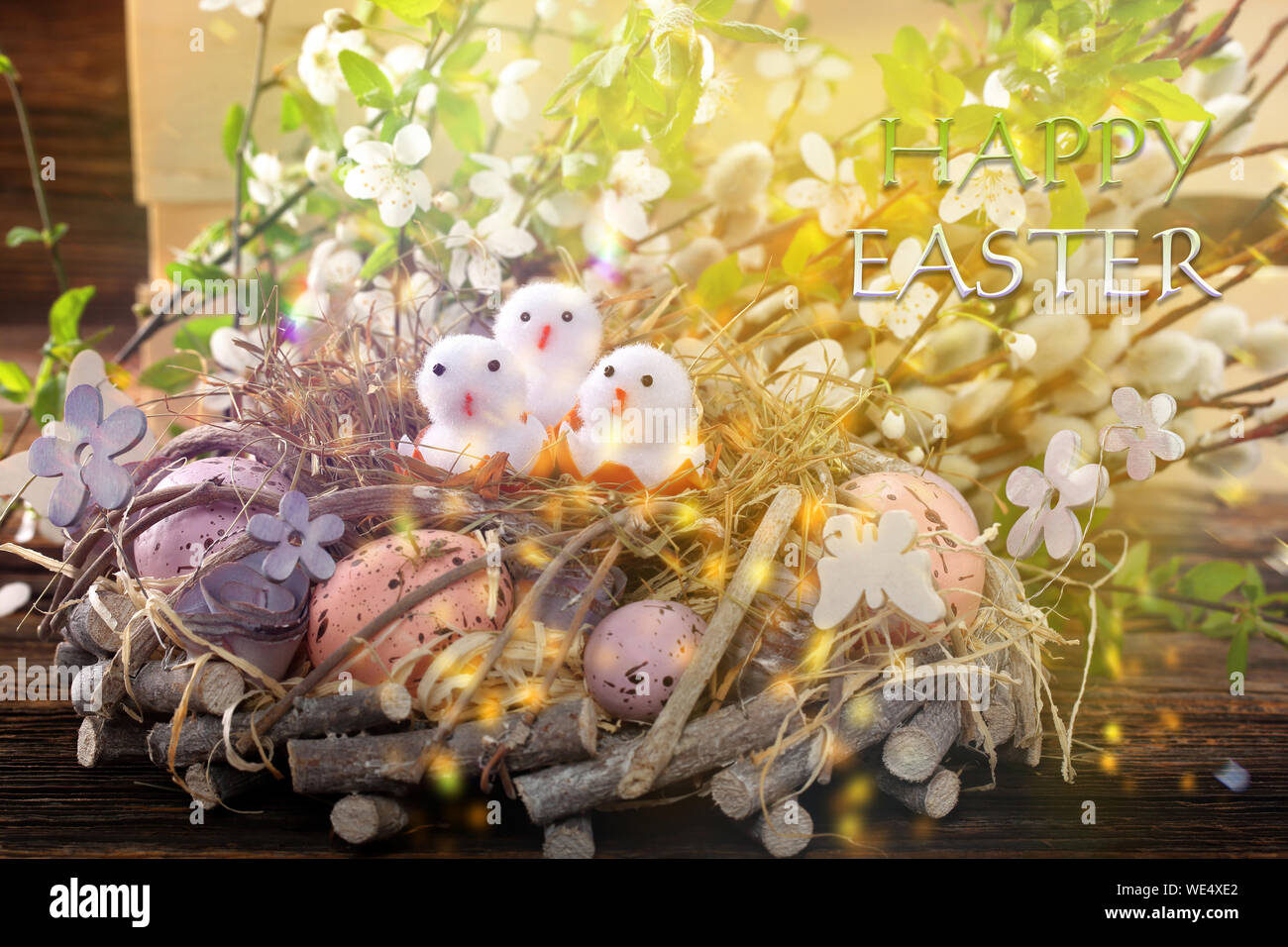Three Easter chicks with happy easter text. Easter holiday concept. Stock Photo