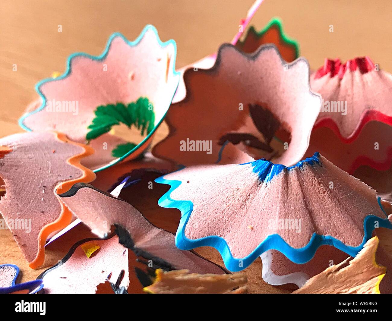 Close-up Of Pencil Shavings On Table Stock Photo