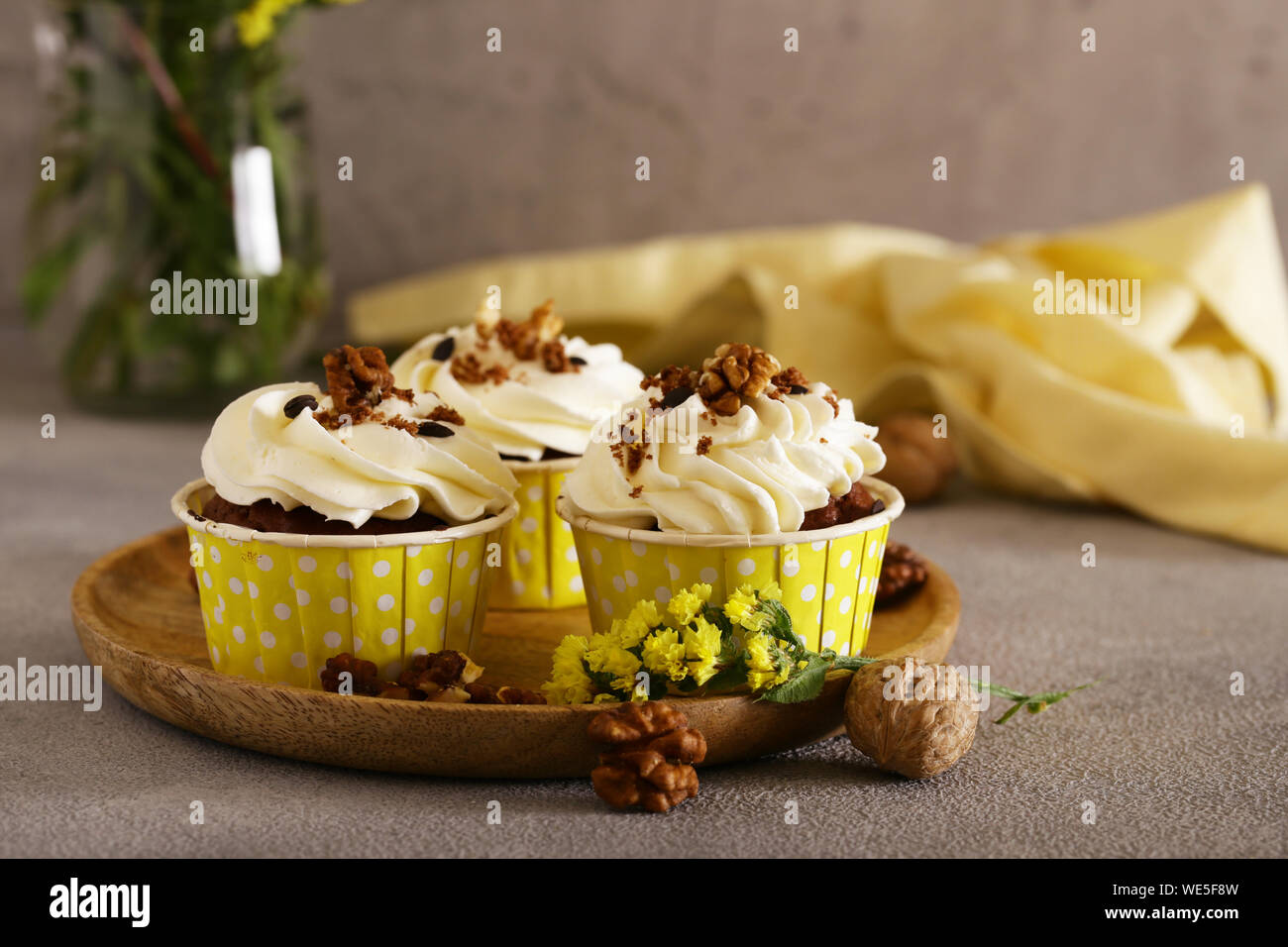cream cupcakes with walnuts for dessert Stock Photo