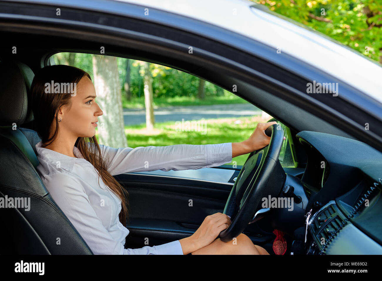 Girl behind steering wheel hi-res stock photography and images - Alamy