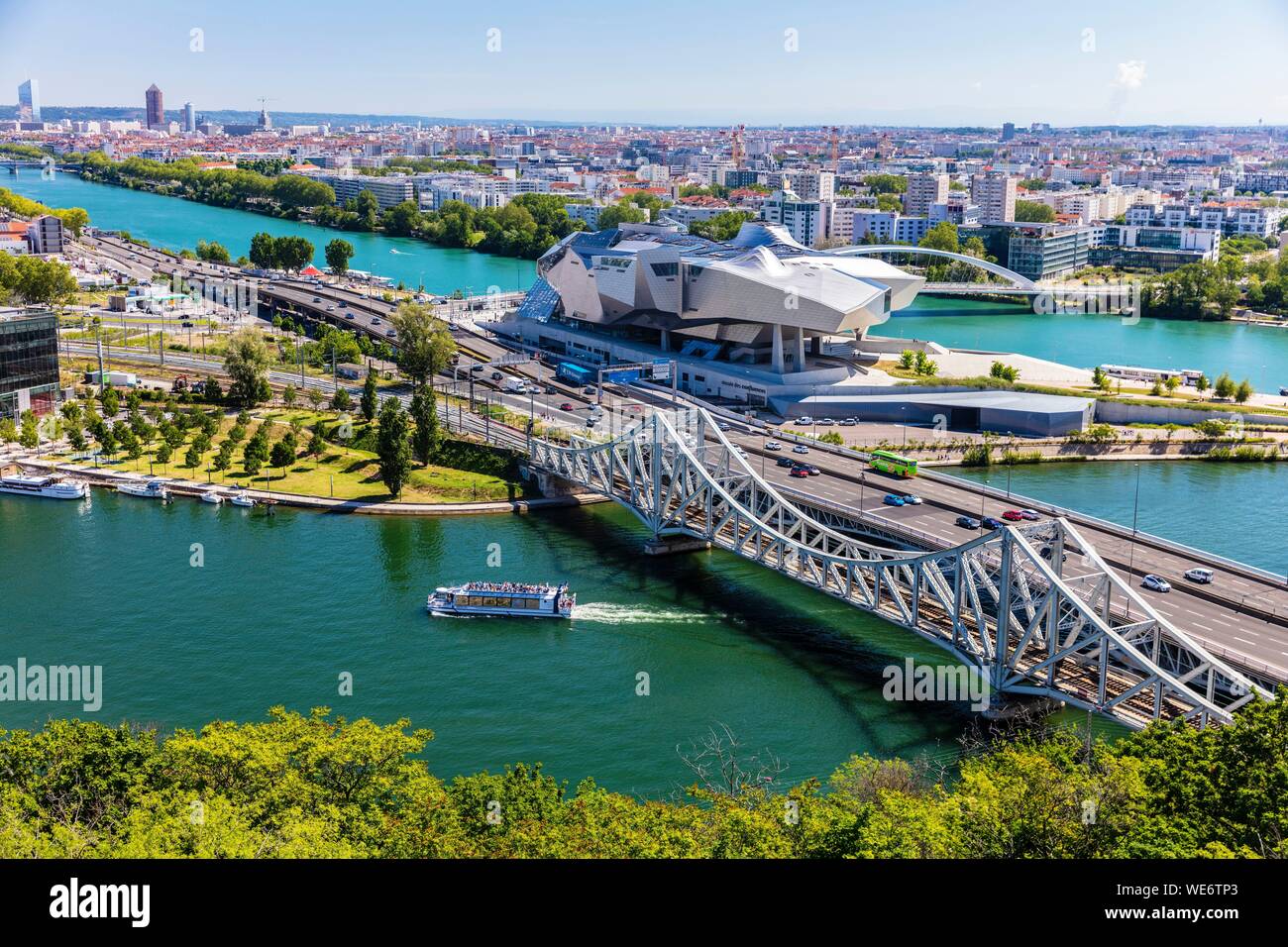 France, Rhone, Lyon, district of La Confluence in the south of the peninsula, first French quarter certified sustainable by the WWF, view on the railway and road bridges of the Mulatiere, the Museum of Confluences, museum of sciences and companies located at the confluence of the Rhone and Saone, the Incity Tower and the Crayon Stock Photo