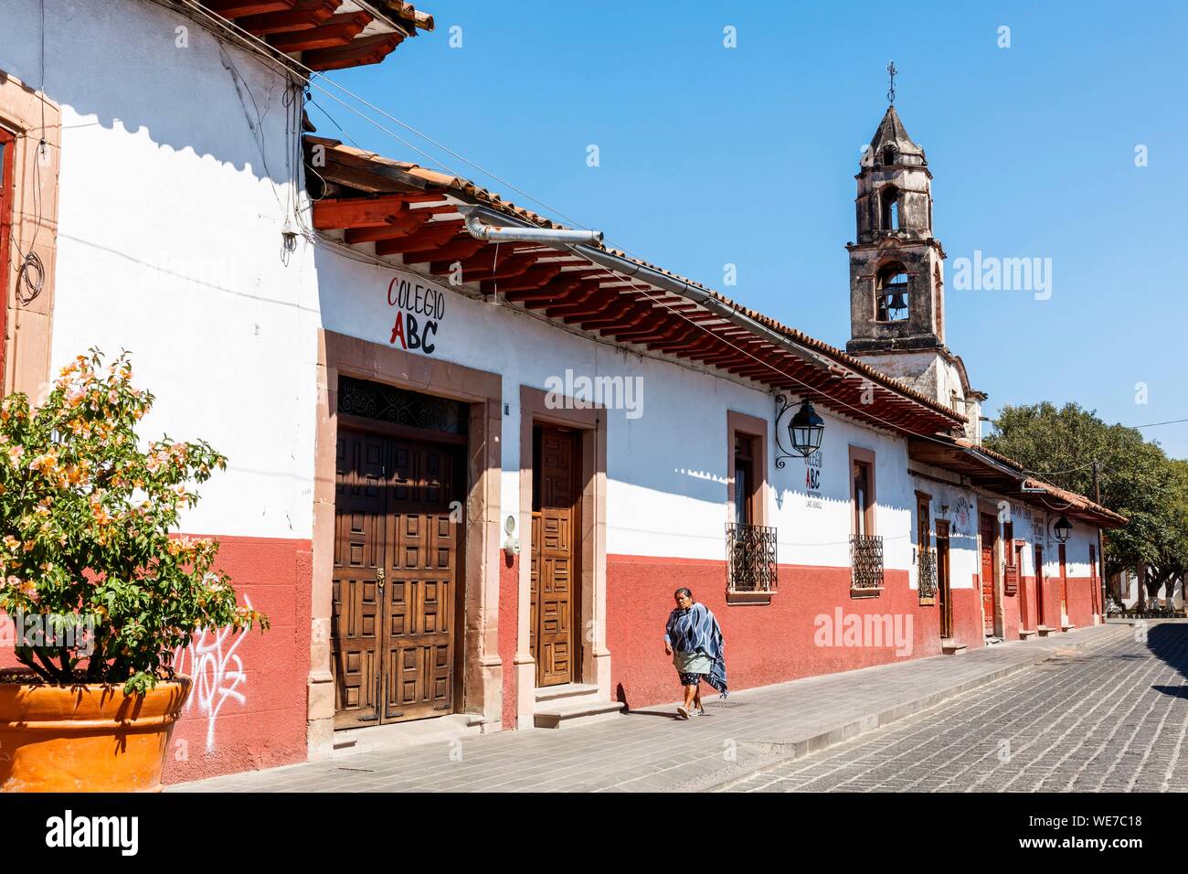 Mexico, Michoacan state, Patzcuaro, typical street with colonial houses and San Juan de Dios clock tower Stock Photo