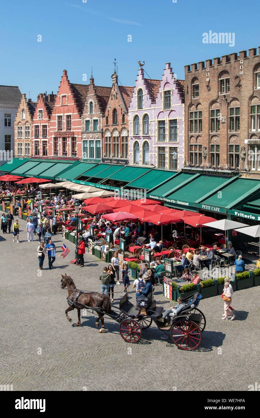 Belgium, Western Flanders, Bruges, historical centre listed as World Heritage by UNESCO, Grand Place, restaurant terraces and gabled house Stock Photo