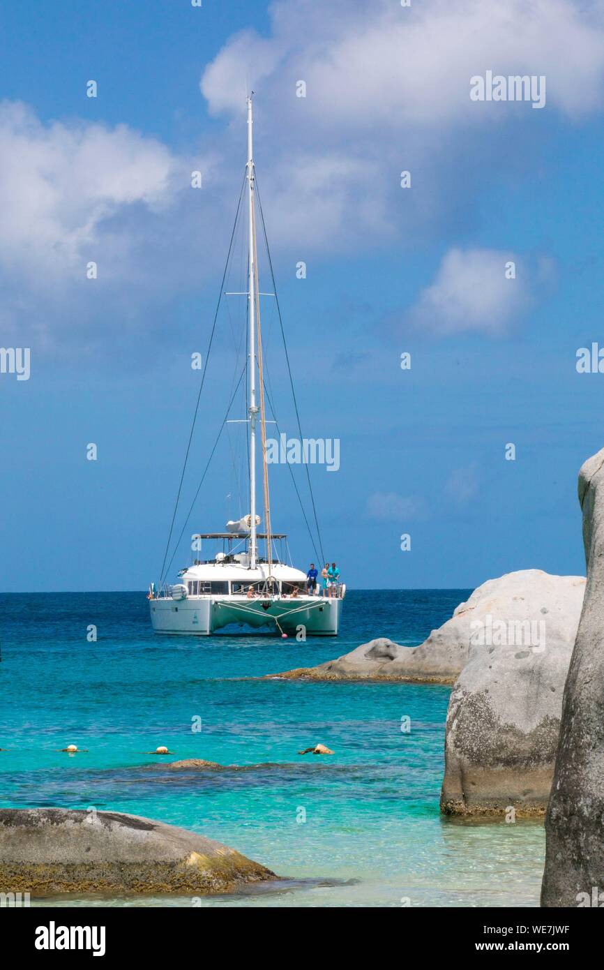 West Indies, British Virgin Islands, Virgin Gorda Island, The Baths, The Baths Beach View, Mooring Cruise Catamaran, in the foreground the typical rocks that surround the paradisiacal swimming area Stock Photo
