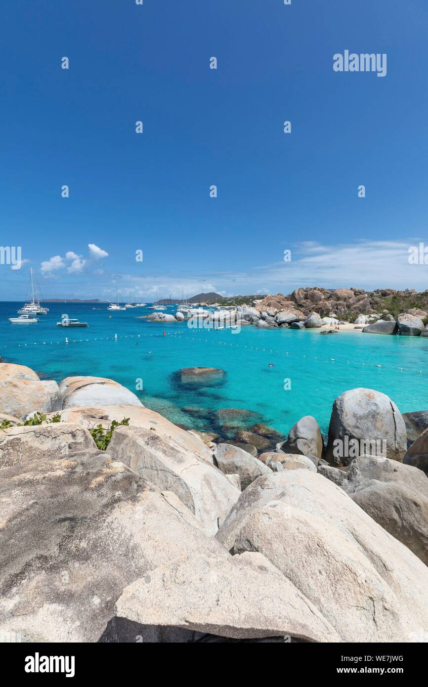 West Indies, British Virgin Islands, Virgin Gorda Island, The Baths, bathing beach view, sailboats at anchor, in the foreground the typical rocks that surround the paradisiacal swimming area Stock Photo