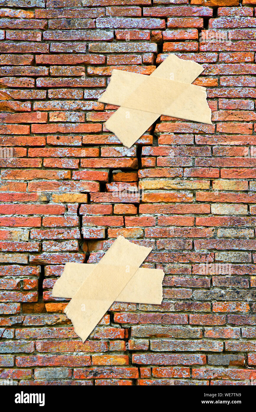 Renovation of cracked brick wall concept image with adhesive tape Stock Photo Alamy