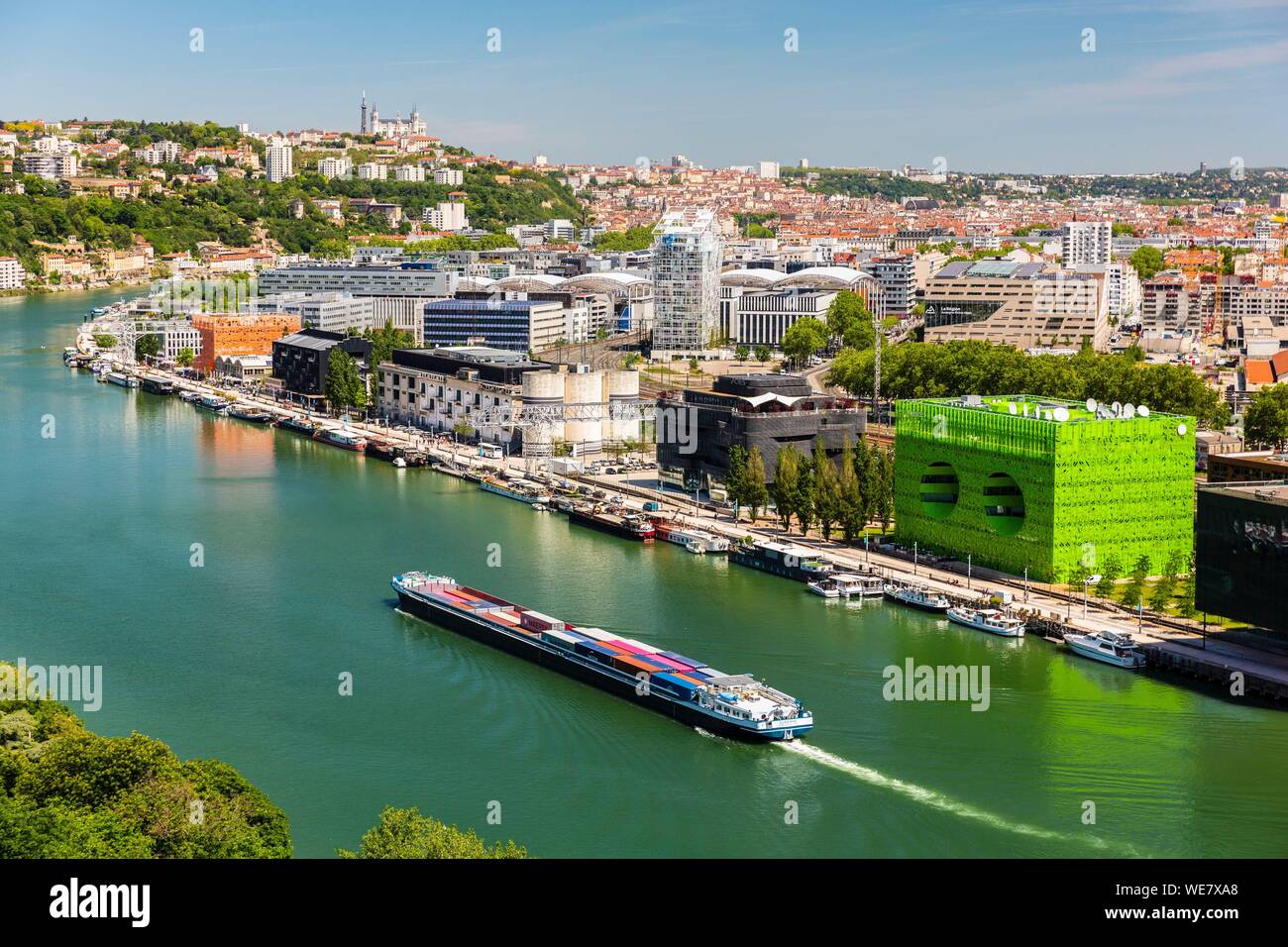 France, Rhône (69), Lyon, district of La Confluence in the south of the peninsula, first French quarter certified sustainable by the WWF, view of the quai Rambaud along the old docks with the Green Cube and Orange Cube and Notre Dame de Fourviere Basilica Stock Photo