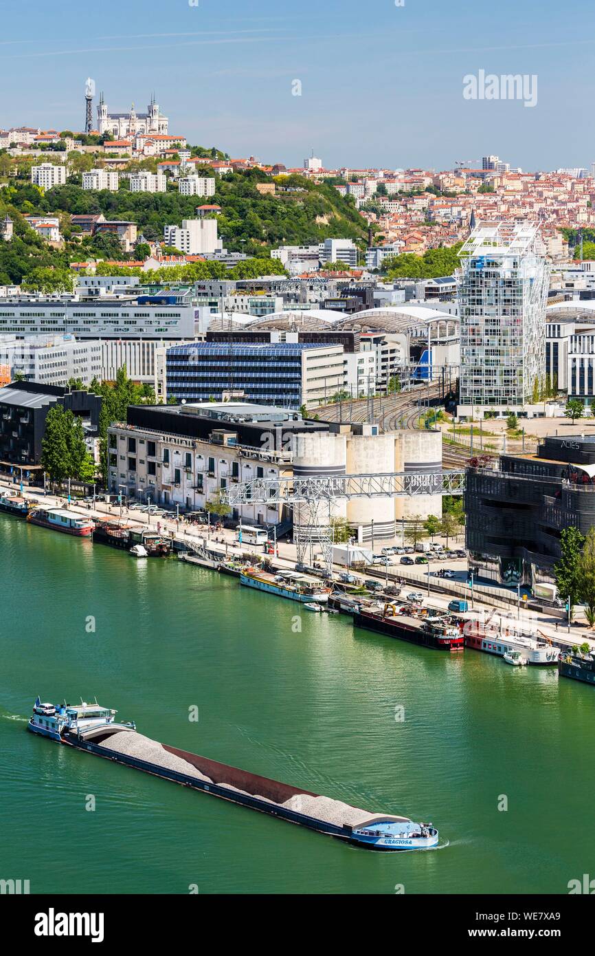 France, Rhone, Lyon, La Confluence district south of the Presqu'ile, close to the confluence of the Rhone and the Saone rivers, quai Rambaud along the former docks, the Ycone tower by Jean Nouvel and the Sucriere, view of the basilica of Notre Dame de Fourviere Stock Photo