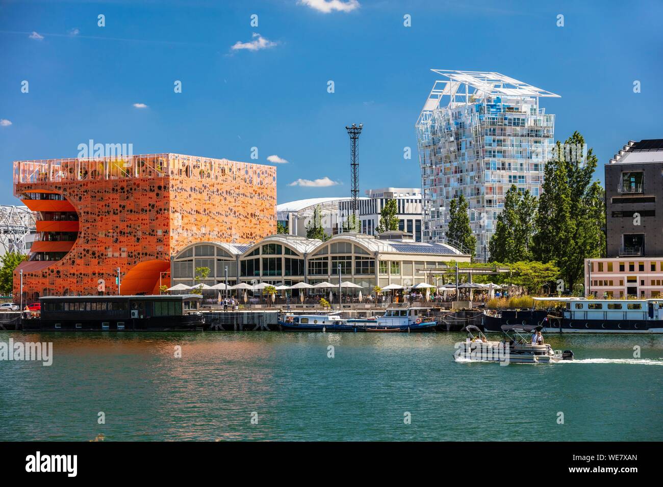 France, Rhone, Lyon, La Confluence district south of the Presqu'ile, close to the confluence of the Rhone and the Saone rivers, quai Rambaud along the former docks, Pavillon des Salins also called Cube Orange by the architects Dominique Jakob and Brendan Mac Farlane and Ycone residential building designed by architect Jean Nouvel Stock Photo