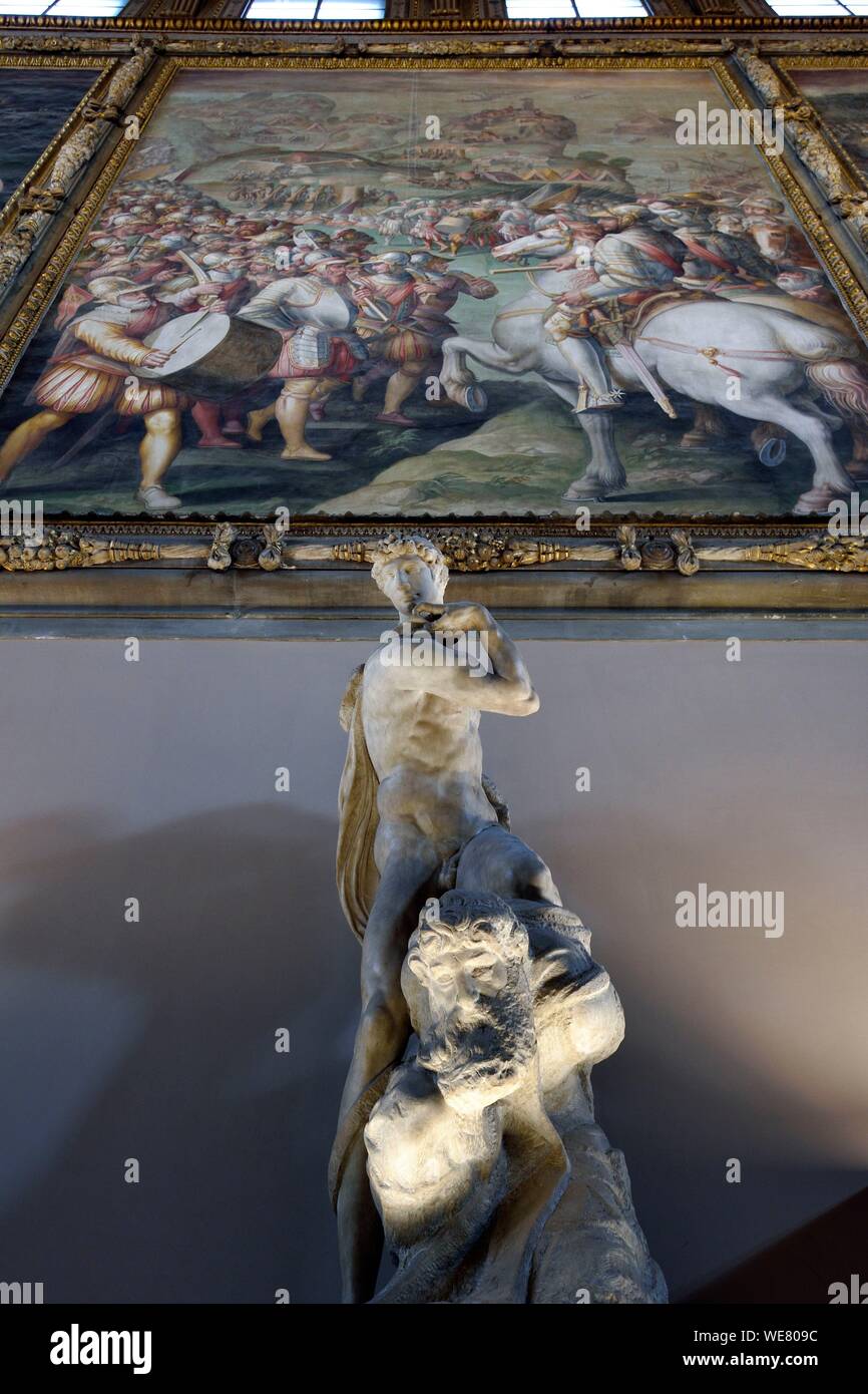 Italy, Tuscany, Florence, listed as World Heritage by UNESCO, the Palazzo Vecchio, Salone dei Cinquecento (Hall of the Five Hundred), the Genius of Victory (Genio della Vittoria), a 1532&#x2013;1534 unfinished marble sculpture by Michelangelo, produced as part of a design for the tomb of Pope Julius II Stock Photo