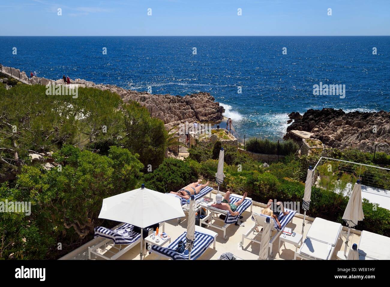 France, Alpes Maritimes, Saint Jean Cap Ferrat, Grand-Hotel du Cap Ferrat, a 5 star palace from Four Seasons Hotel, the chic poolside Club Dauphin facing the sea where you can sunbathe in complete relaxation Stock Photo