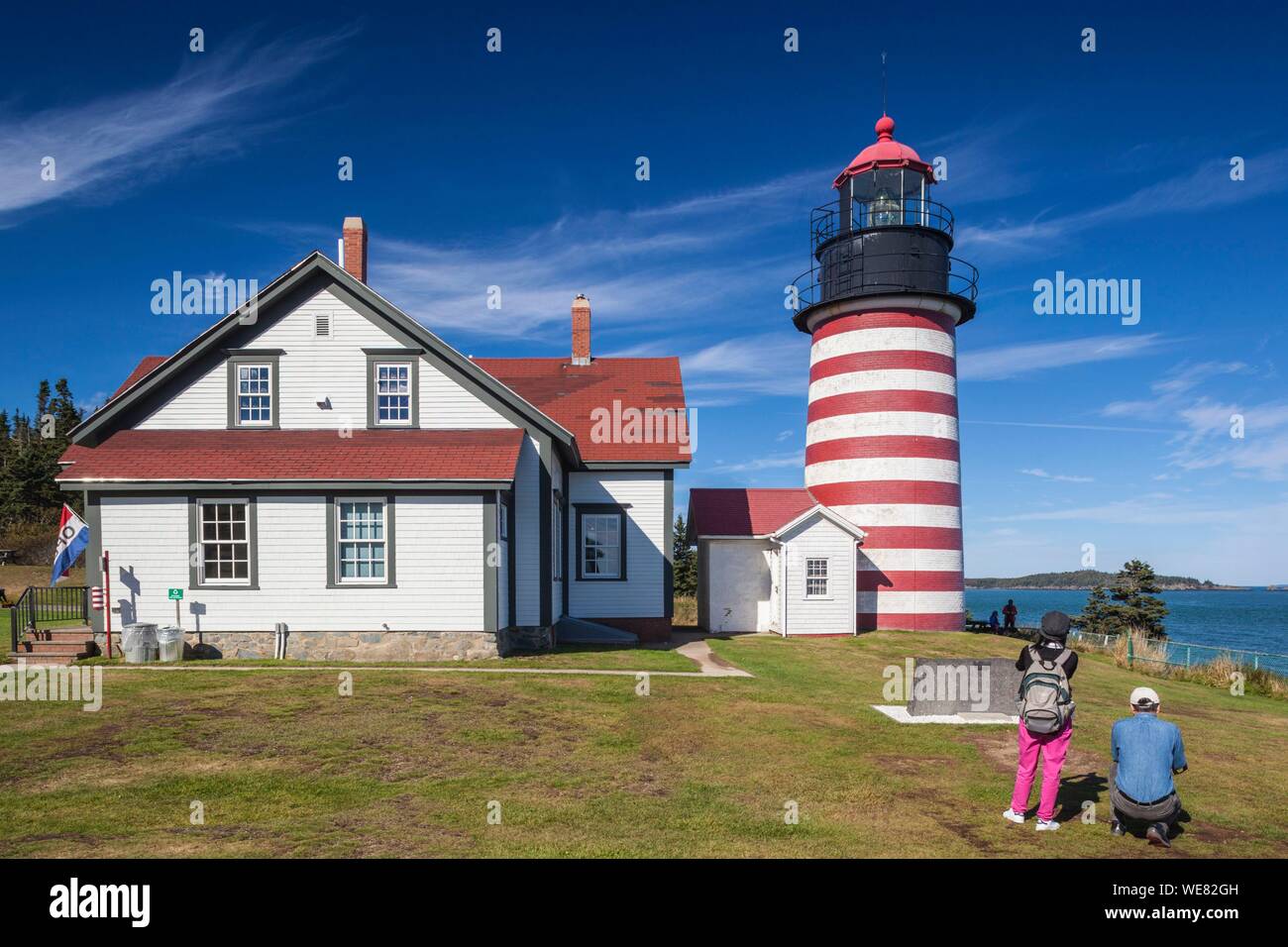 United States, Maine, Lubec, West Quoddy Head Llight lighthouse with visitors Stock Photo