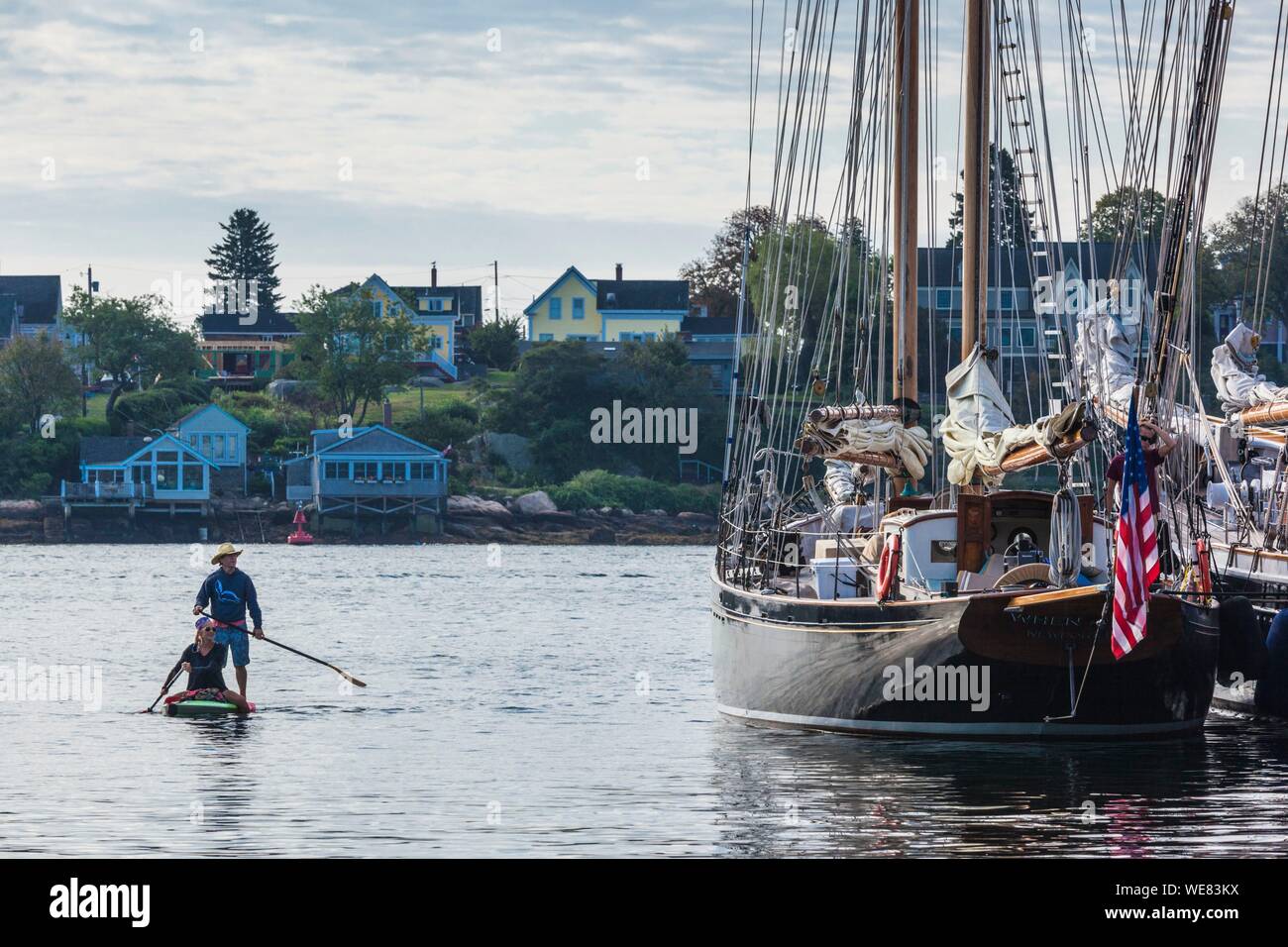 United States, New England, Massachusetts, Cape Ann, Gloucester, Gloucester Schooner Festival, paddleboarders among the schooners Stock Photo