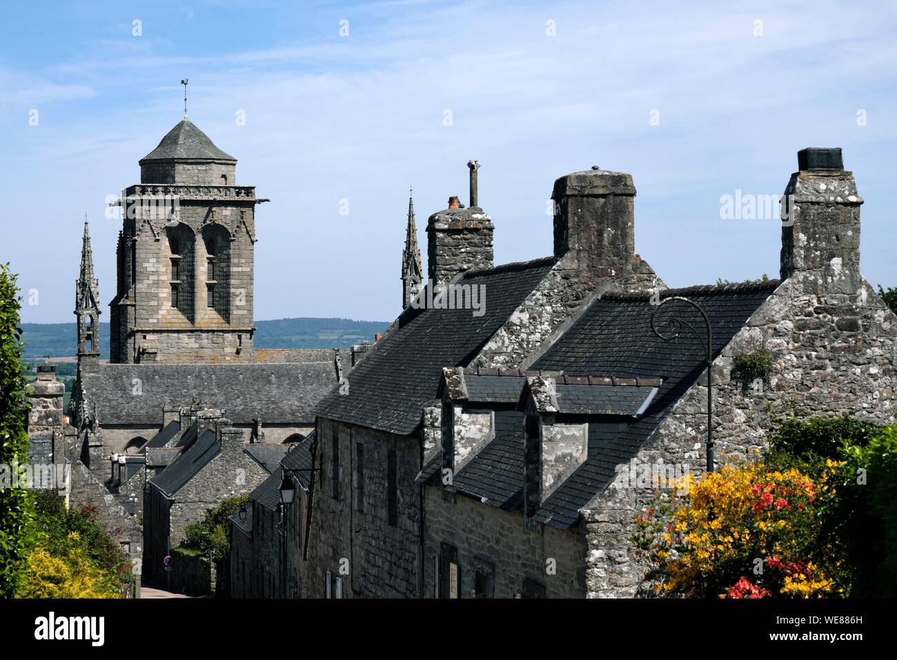 France, Finistere, Locronan, labelled Les Plus Beaux Villages de France (The Most beautiful Villages of France), village, Saint Ronan church dated 15th century, rhododendron in bloom Stock Photo