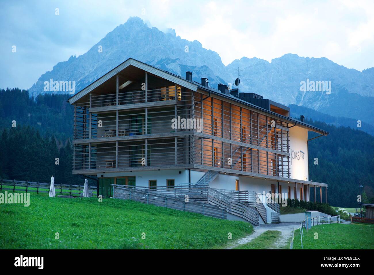 Italy, autonomous province of Bolzano, San Candido, joas hotel posed on pastures at the foot of the Dolomites mountains Stock Photo