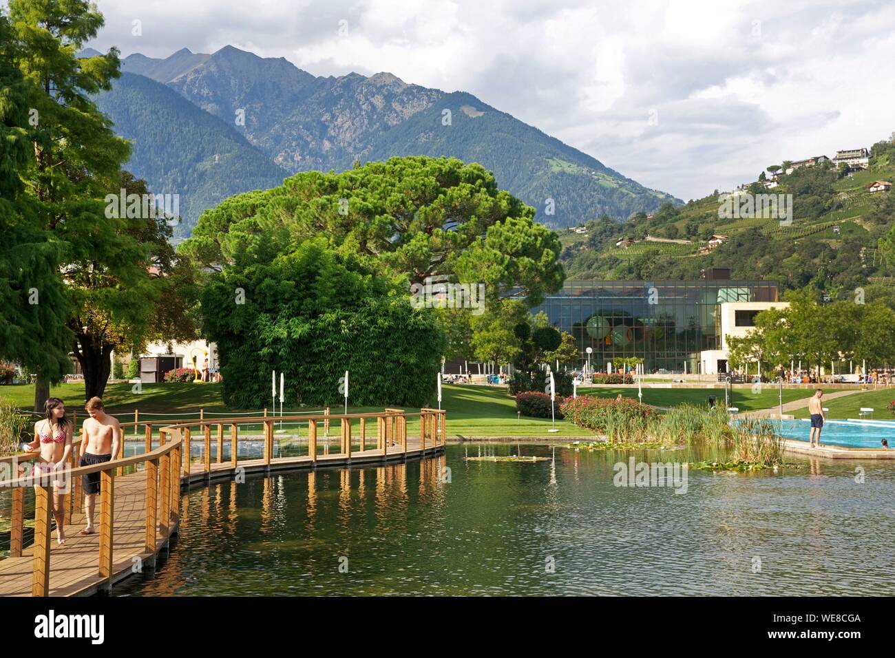 Italy, autonomous province of Bolzano, Merano, outdoor aquatic areas and park sported terms of Merano with mountains for scenery Stock Photo