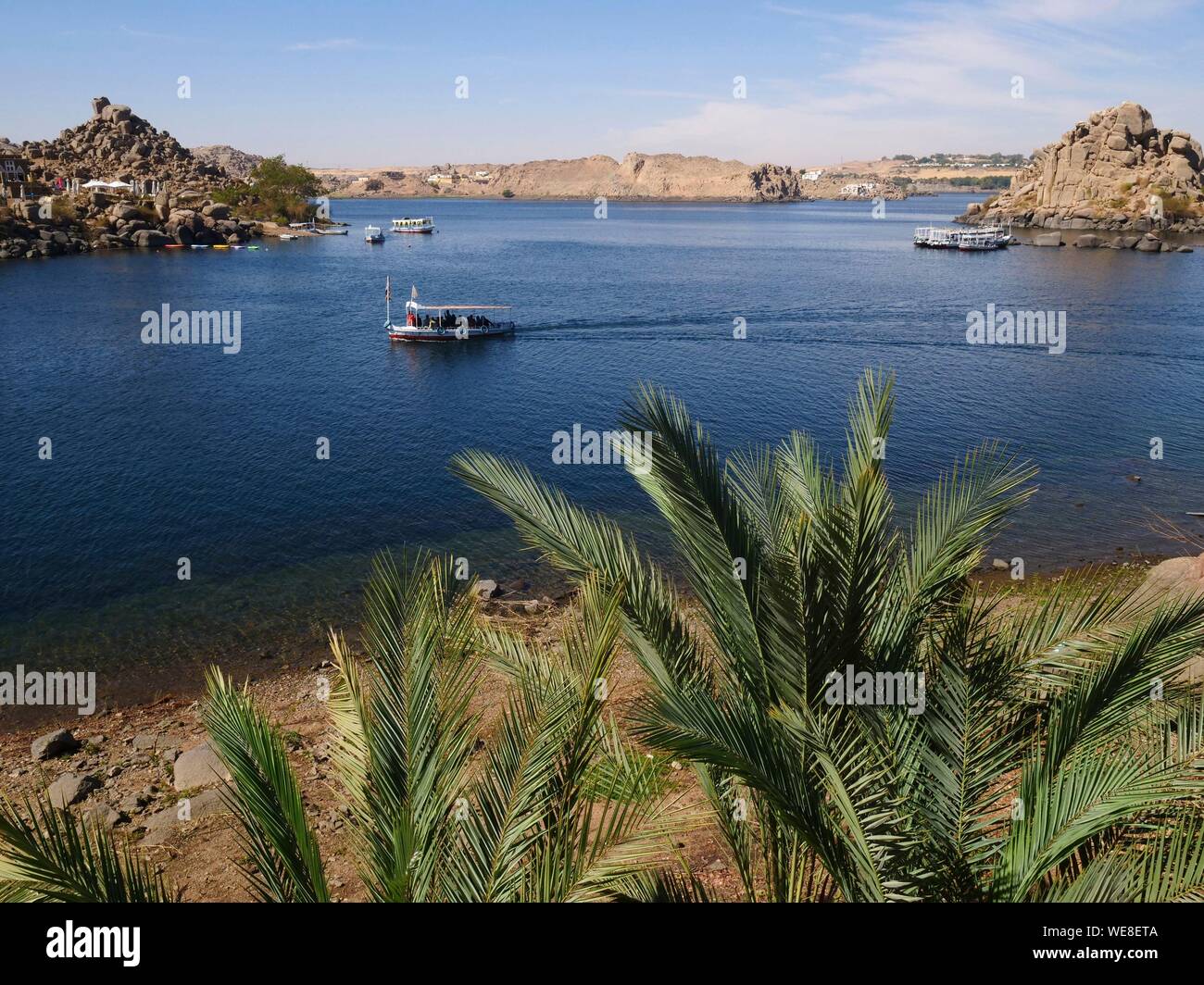 Egypt, Upper Egypt, Nubia, Nile Valley, Aswan, Island of Agilka, Arrival of tourists by boat to visit the Philae Temple World Heritage Site of UNESCO, the Temple of Isis Stock Photo