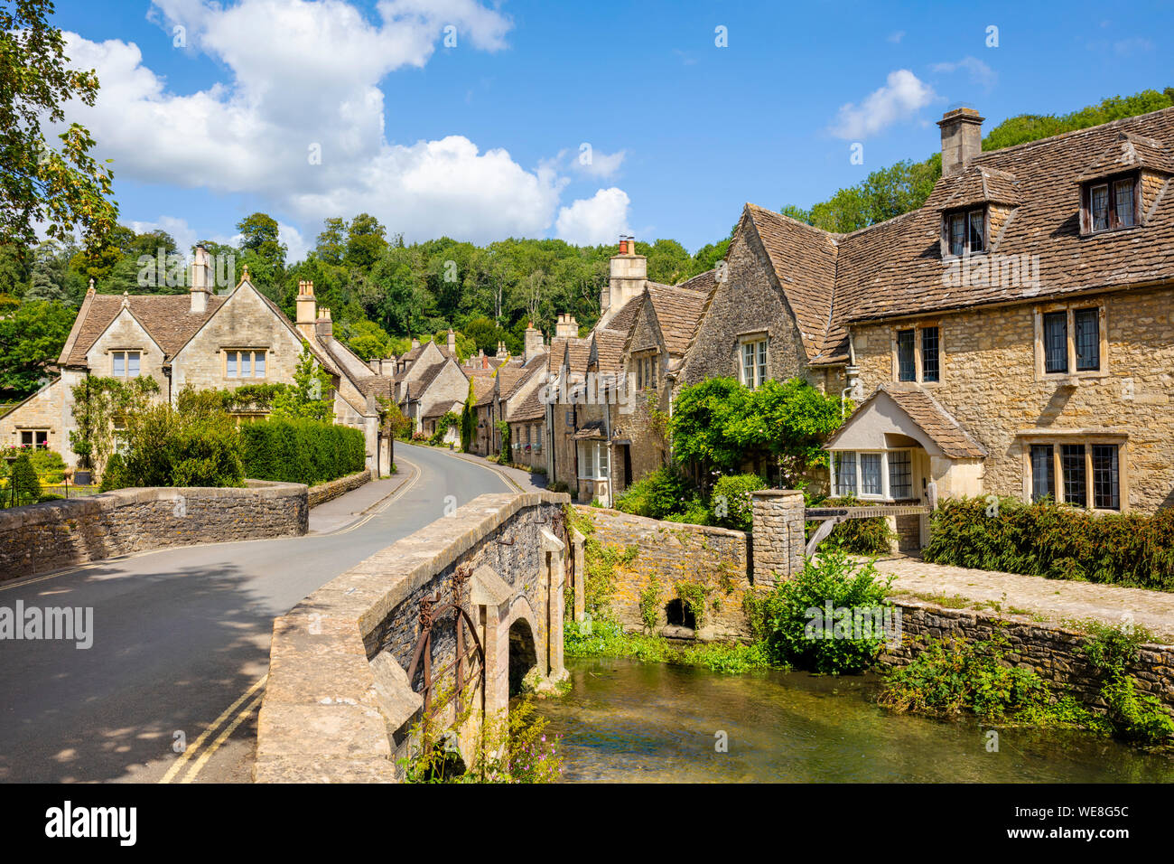 Castle Combe Water lane with bridge over the By brook on to The Street Castle Combe village Castle Combe Cotswolds Wiltshire england gb uk Europe Stock Photo