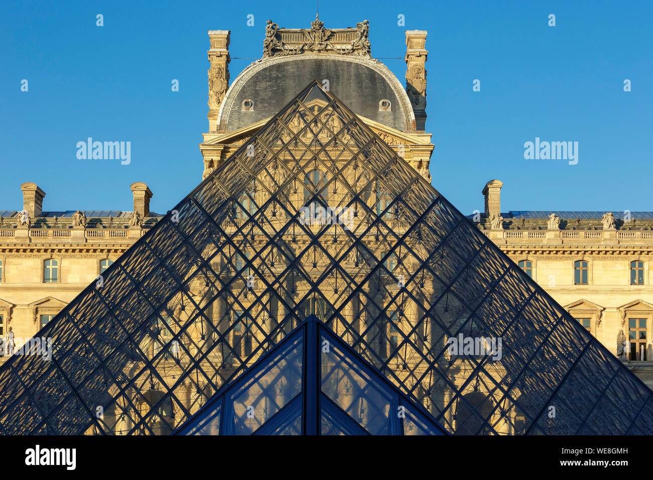 France, Paris, area listed as World Heritage by UNESCO, reflection of the facade of the Richelieu Wing on the pyramid of the Louvre by the architect Ieoh Ming Pei in the Cour Napoleon Stock Photo