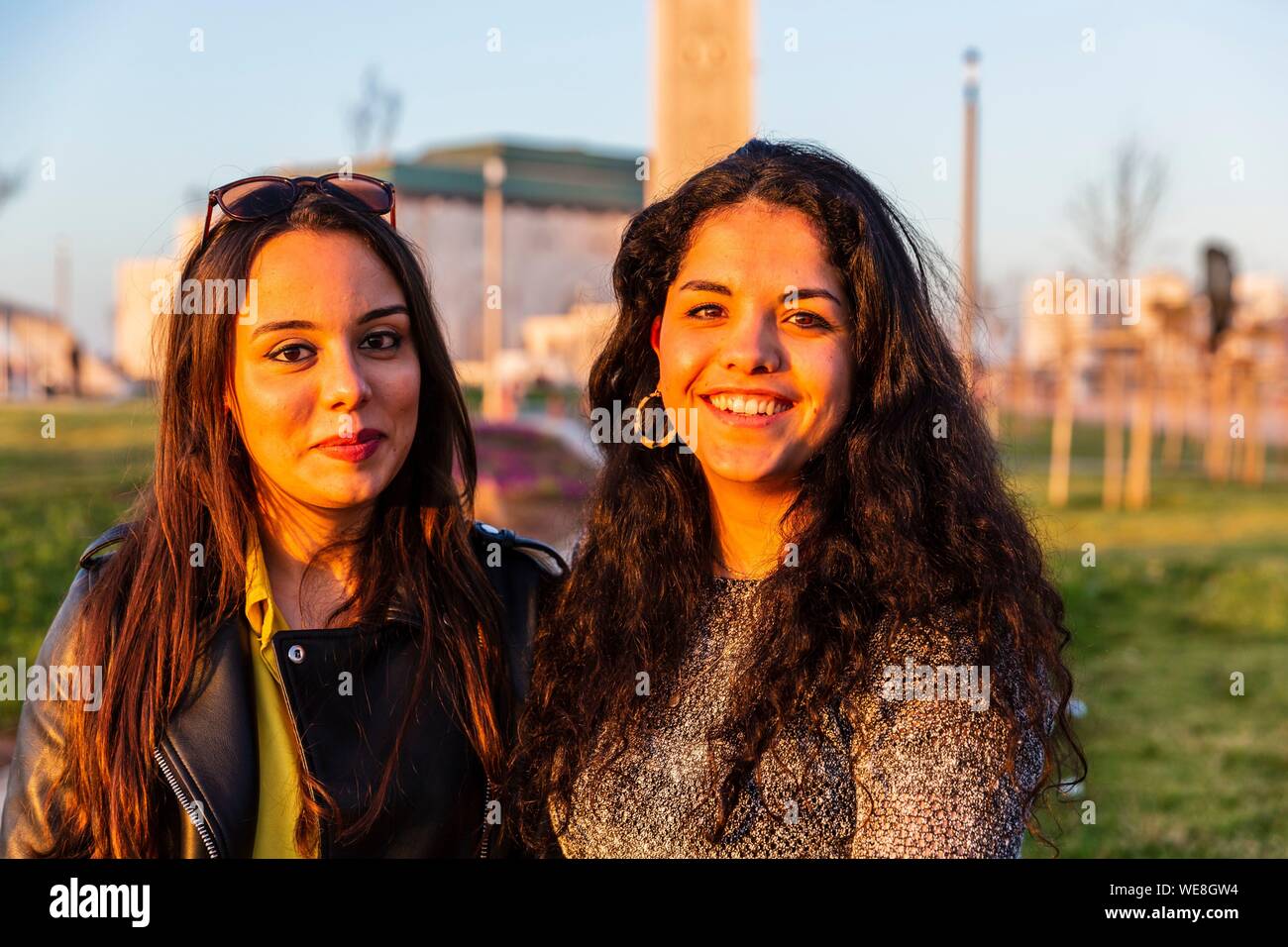 Morocco, Casablanca, young women on the forecourt of the Hassan II mosque Stock Photo