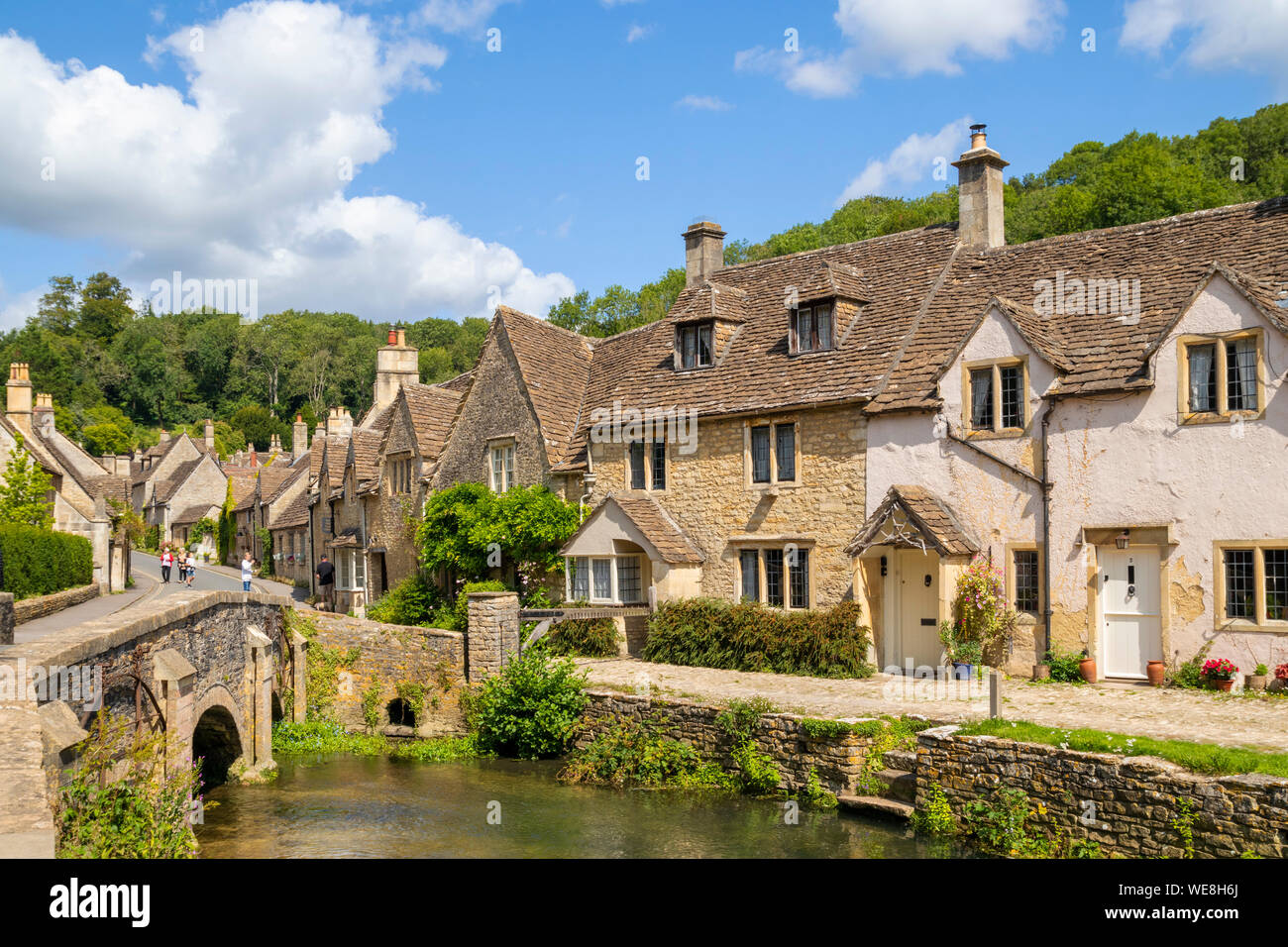 Castle Combe Water lane with bridge over the By brook on to The Street Castle Combe village Castle Combe Cotswolds Wiltshire england gb uk Europe Stock Photo