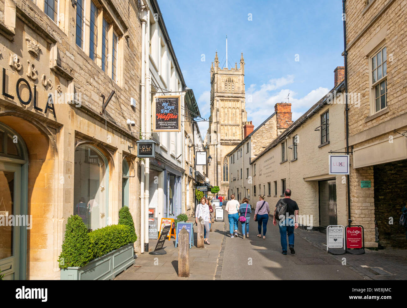 Black jack Street Cirencester and St. John the Baptist church Cirencester town centre Cirencester Wiltshire england uk gb Europe Stock Photo