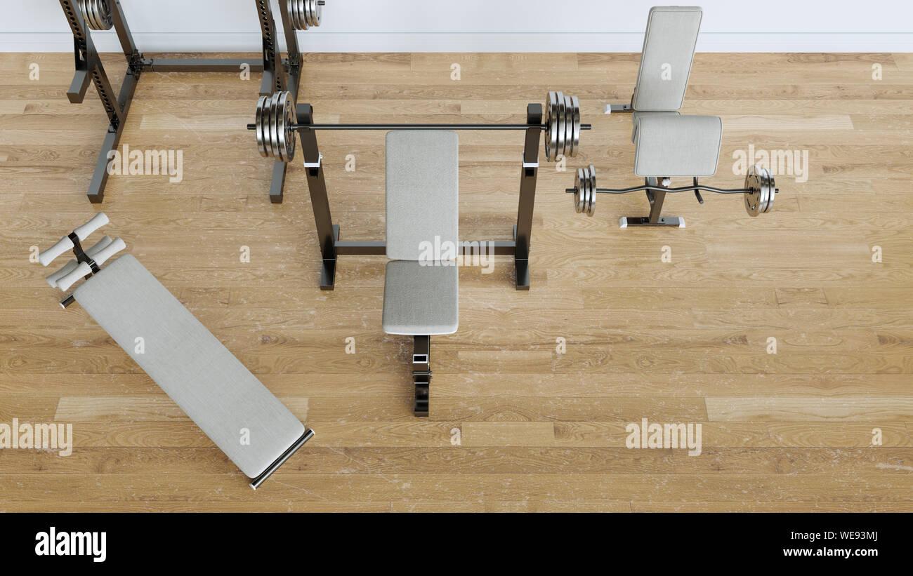 Weight training equipment in white empty room on parquet floor - 3D Rendering Stock Photo
