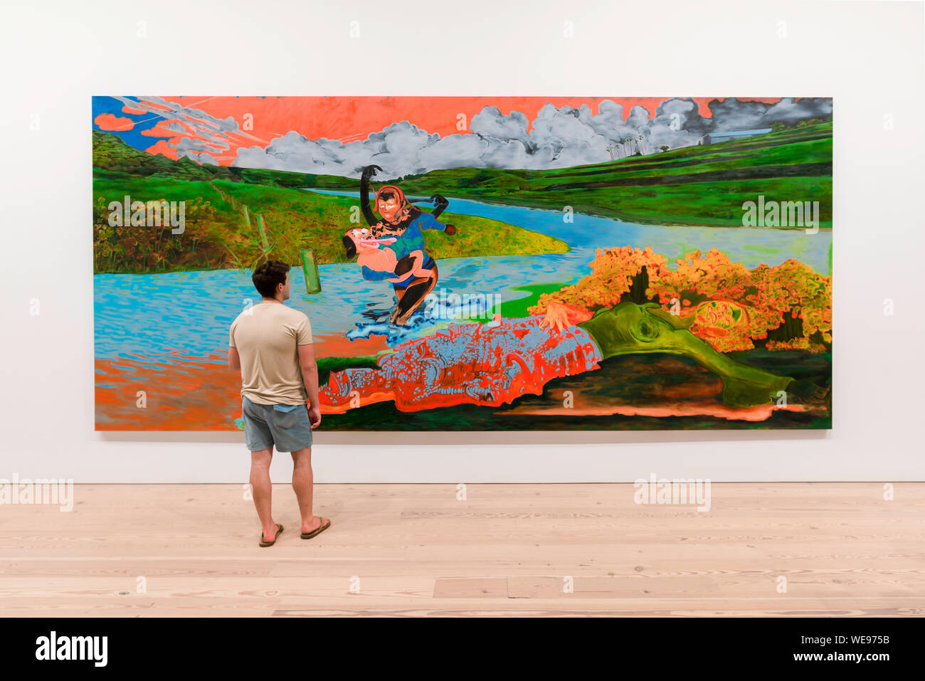 Man art painting, view of a young man looking at Uh Oh, Look Who Got Wet (2019) by Janiva Ellis, Whitney Museum Of American Art, New York City, USA Stock Photo