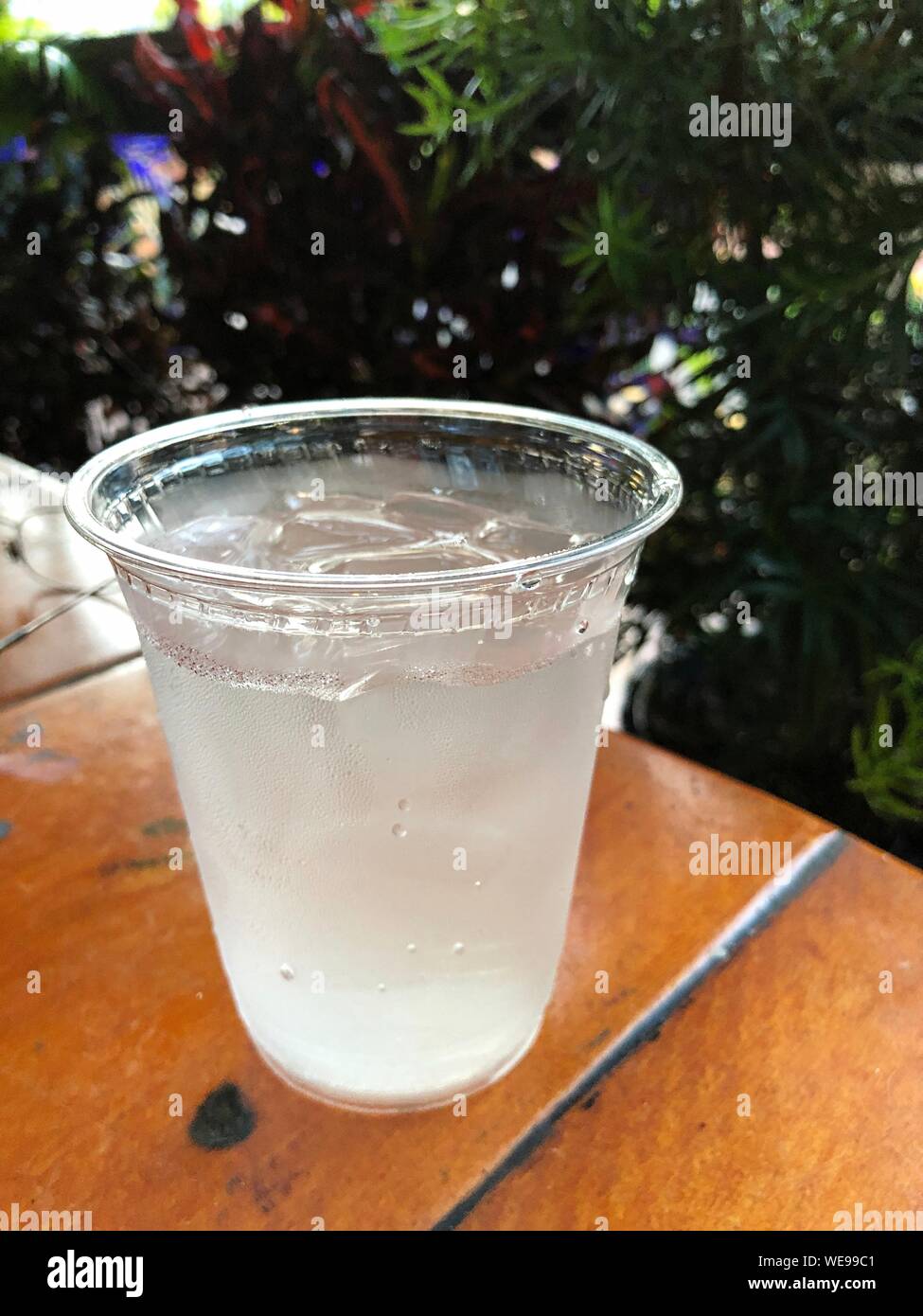 Cold water with ice cubes in a plastic glass Stock Photo Alamy