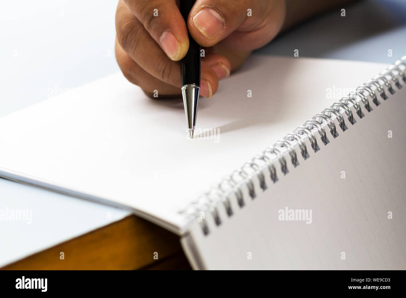Man holding up writing pad hi-res stock photography and images - Alamy