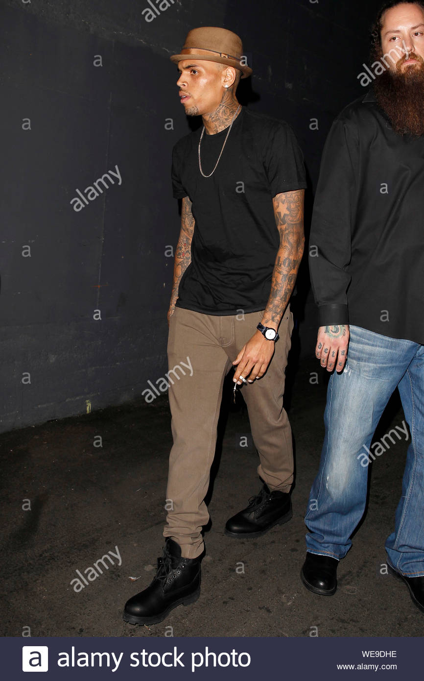 brown pants black t shirt