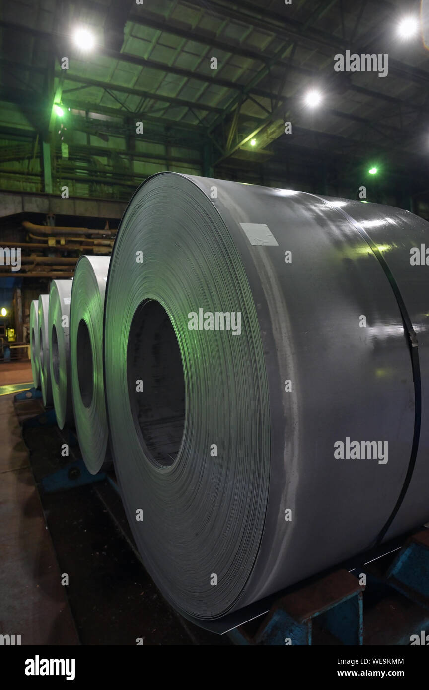 Steel coils rolled in the steel plant Stock Photo